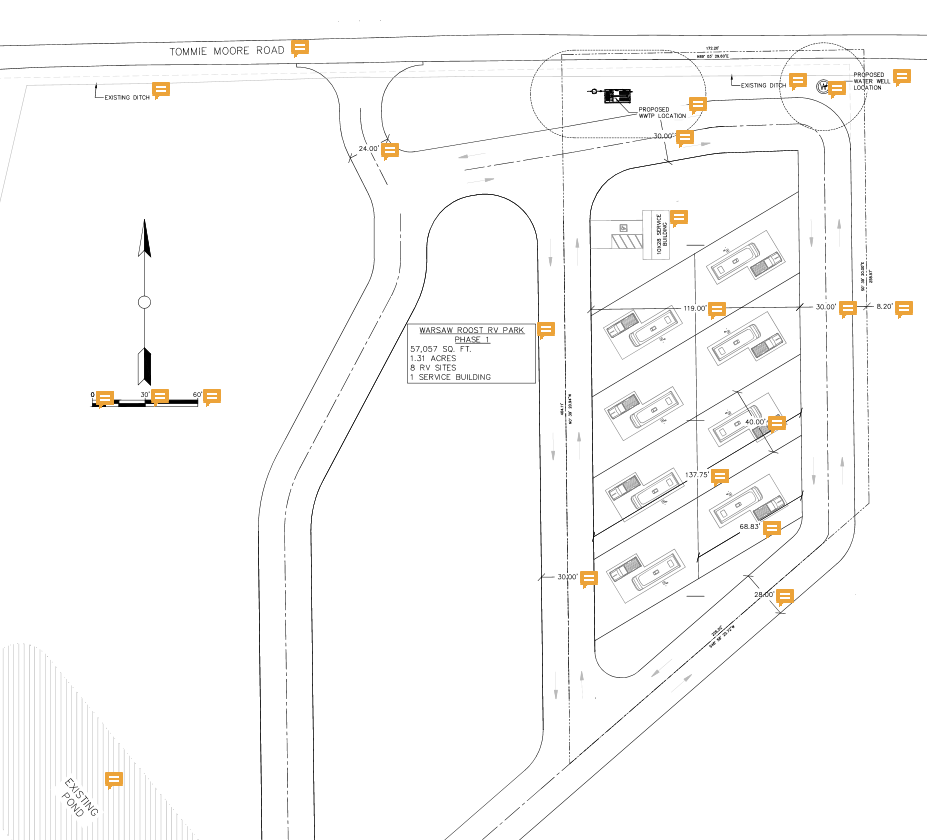 Preliminary Phase 1 plan showing eight RV sites, an interior loop road, and a service building off Tommie Moore Road